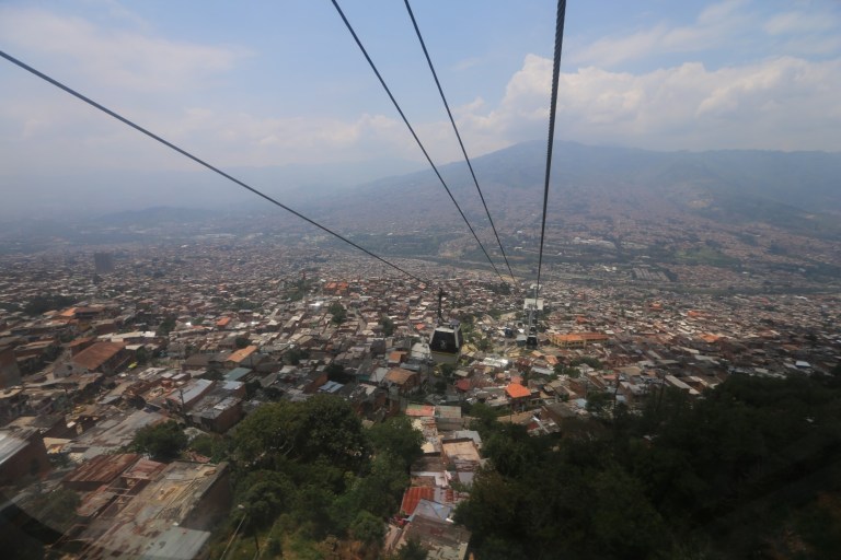 Down into the city from the slums.