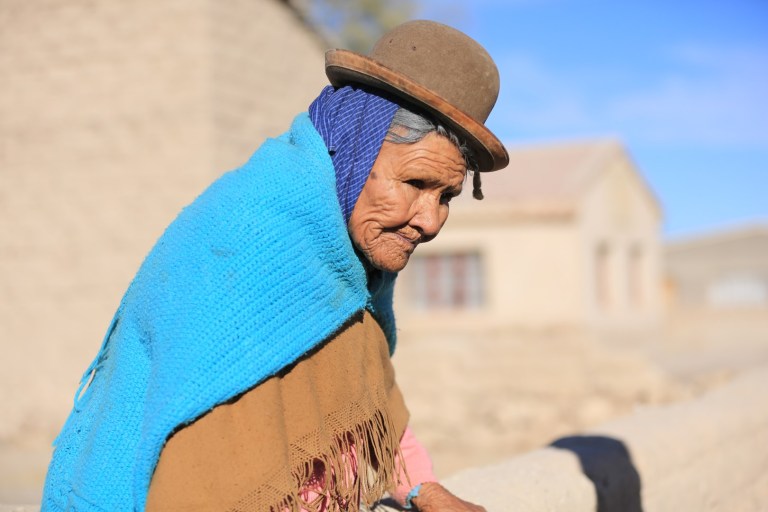 Bolivian woman in San Juan.  She could be 80 or she could be 40.  Who knows.