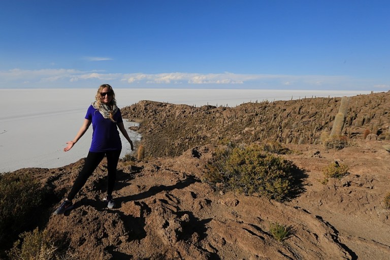 Katie standing on the cactus island in the sea of salt (no water).  It's the only "land" for miles.