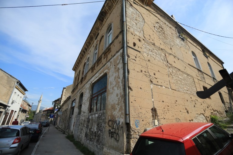 The holes in this wall are from bullets that are less that 20 years old