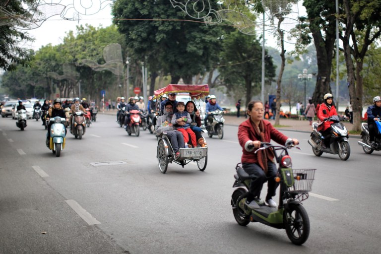 Pedicab in the middle of traffic - people smiling and waving at me :)