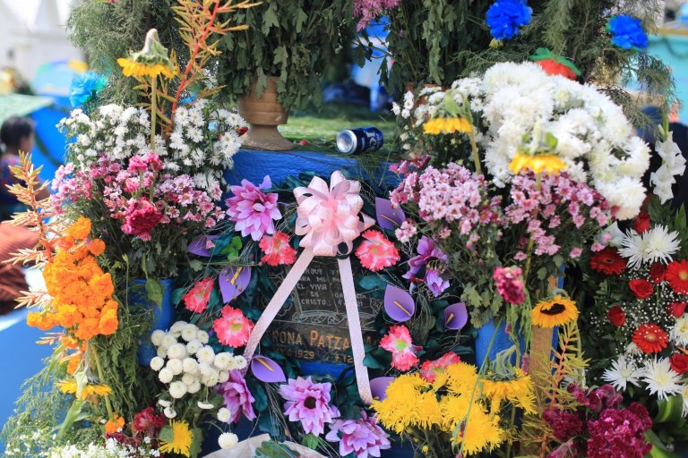 The beer here is left through respect. The family was having a picnic on the grave and this was probably left for the deceased.