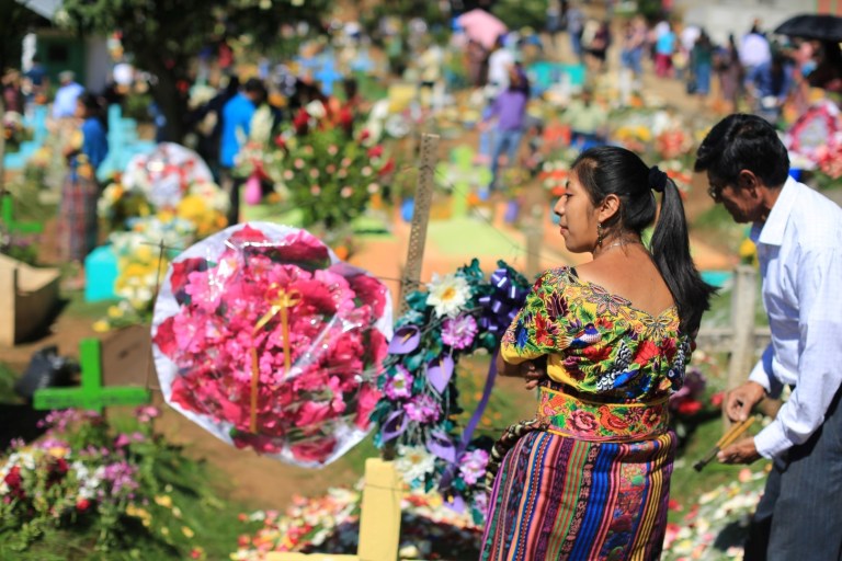 In addition the graves at the cemetery near by are decorated vibrantly.