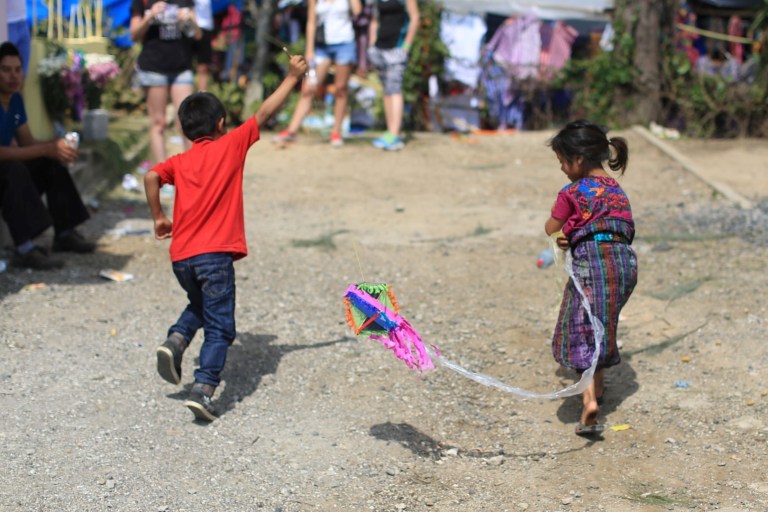 Children played in the cemetery - flying kites and laughing and running.